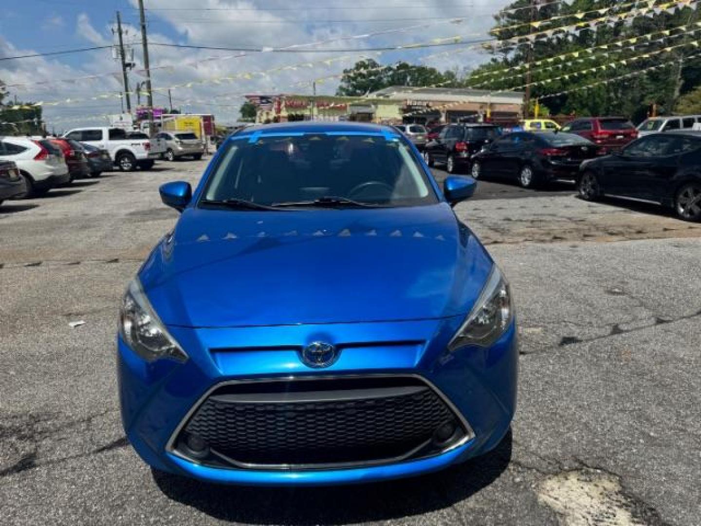 2020 Blue Toyota Yaris Sedan LE (3MYDLBYV4LY) with an 1.5L I-4 gasoline direct injection engine, located at 1806 Veterans Memorial Hwy SW, Austell, GA, 30168, (770) 944-9558, 33.817959, -84.606987 - Photo#1