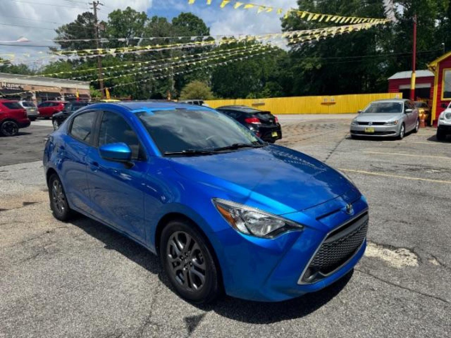 2020 Blue Toyota Yaris Sedan LE (3MYDLBYV4LY) with an 1.5L I-4 gasoline direct injection engine, located at 1806 Veterans Memorial Hwy SW, Austell, GA, 30168, (770) 944-9558, 33.817959, -84.606987 - Photo#2