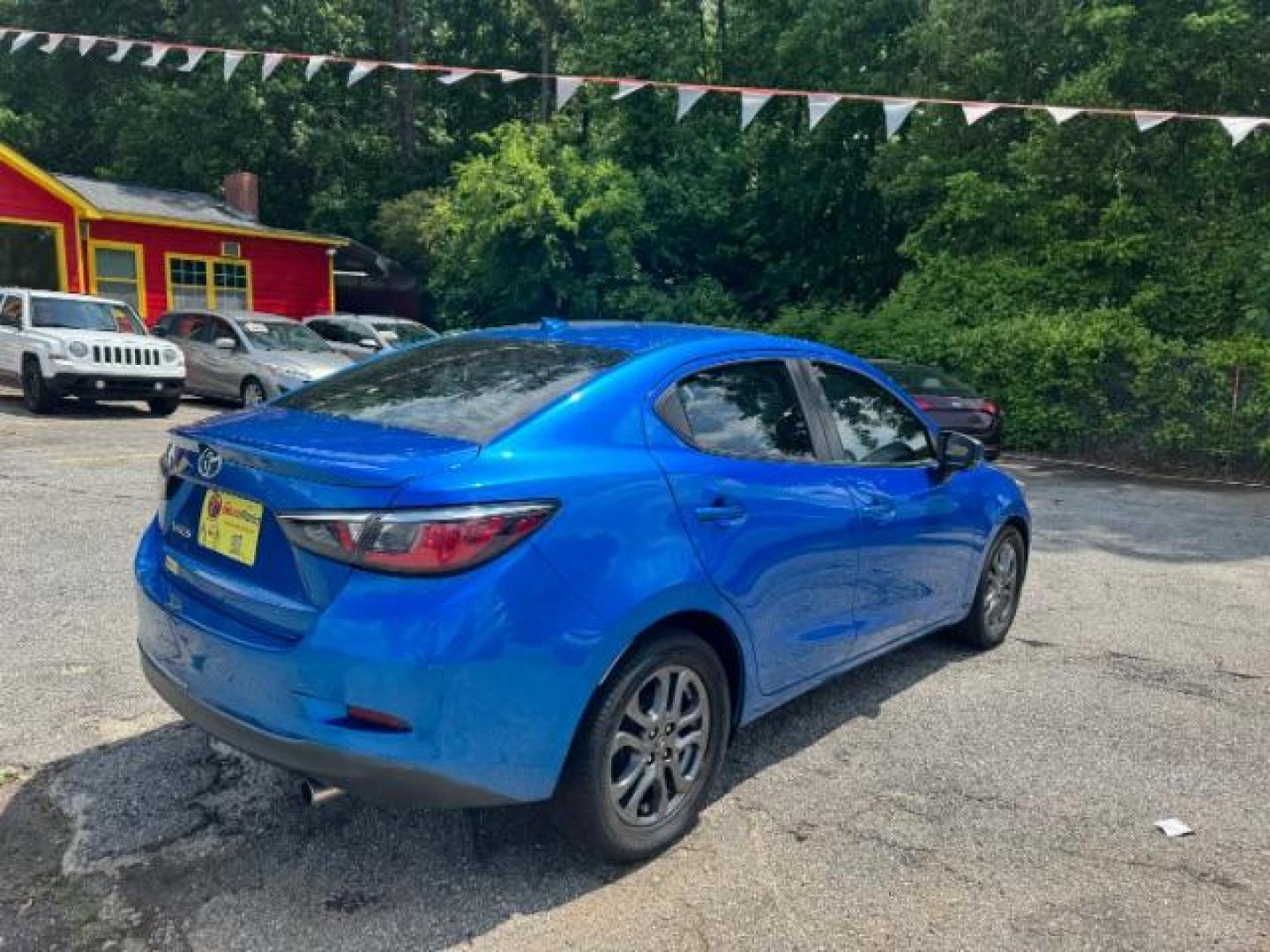 2020 Blue Toyota Yaris Sedan LE (3MYDLBYV4LY) with an 1.5L I-4 gasoline direct injection engine, located at 1806 Veterans Memorial Hwy SW, Austell, GA, 30168, (770) 944-9558, 33.817959, -84.606987 - Photo#3