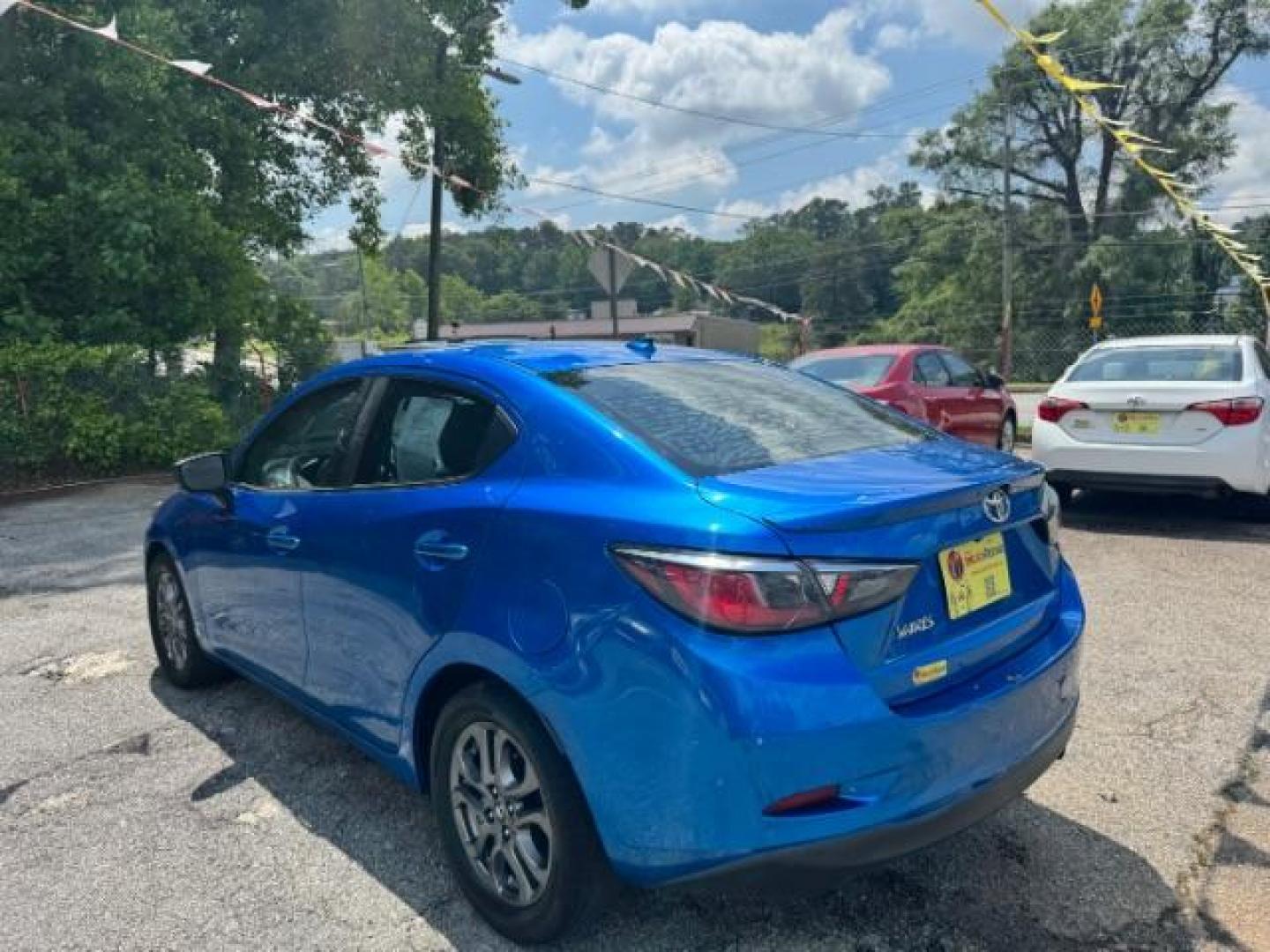 2020 Blue Toyota Yaris Sedan LE (3MYDLBYV4LY) with an 1.5L I-4 gasoline direct injection engine, located at 1806 Veterans Memorial Hwy SW, Austell, GA, 30168, (770) 944-9558, 33.817959, -84.606987 - Photo#5