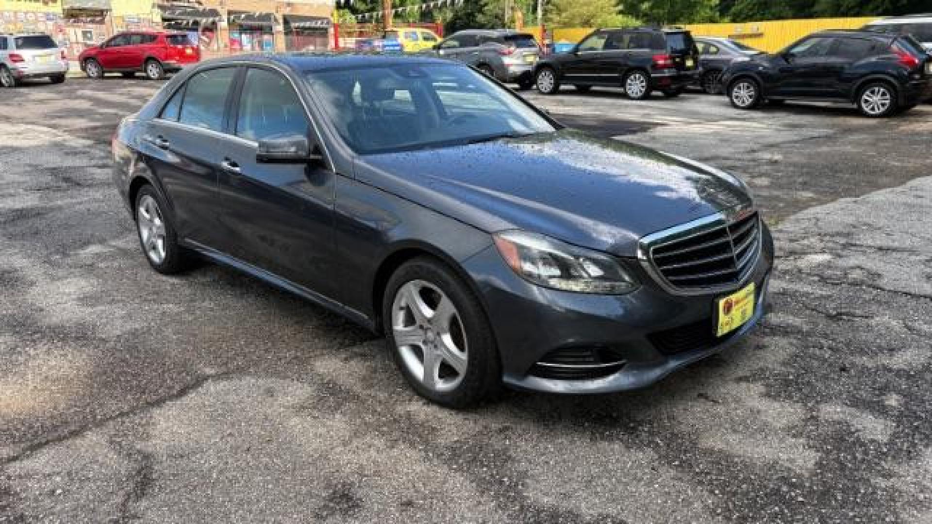 2014 Gray Mercedes-Benz E 350 4MATIC (WDDHF8JB0EA) with an 3.5L V-6 gasoline direct injection engine, located at 1806 Veterans Memorial Hwy SW, Austell, GA, 30168, (770) 944-9558, 33.817959, -84.606987 - Photo#2
