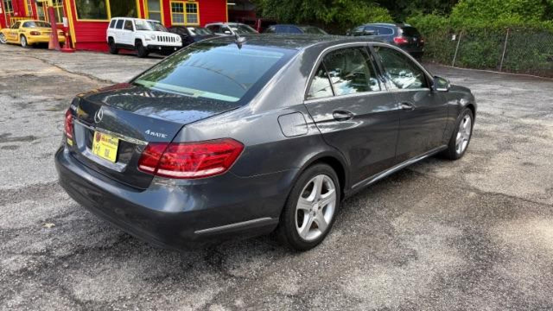 2014 Gray Mercedes-Benz E 350 4MATIC (WDDHF8JB0EA) with an 3.5L V-6 gasoline direct injection engine, located at 1806 Veterans Memorial Hwy SW, Austell, GA, 30168, (770) 944-9558, 33.817959, -84.606987 - Photo#3
