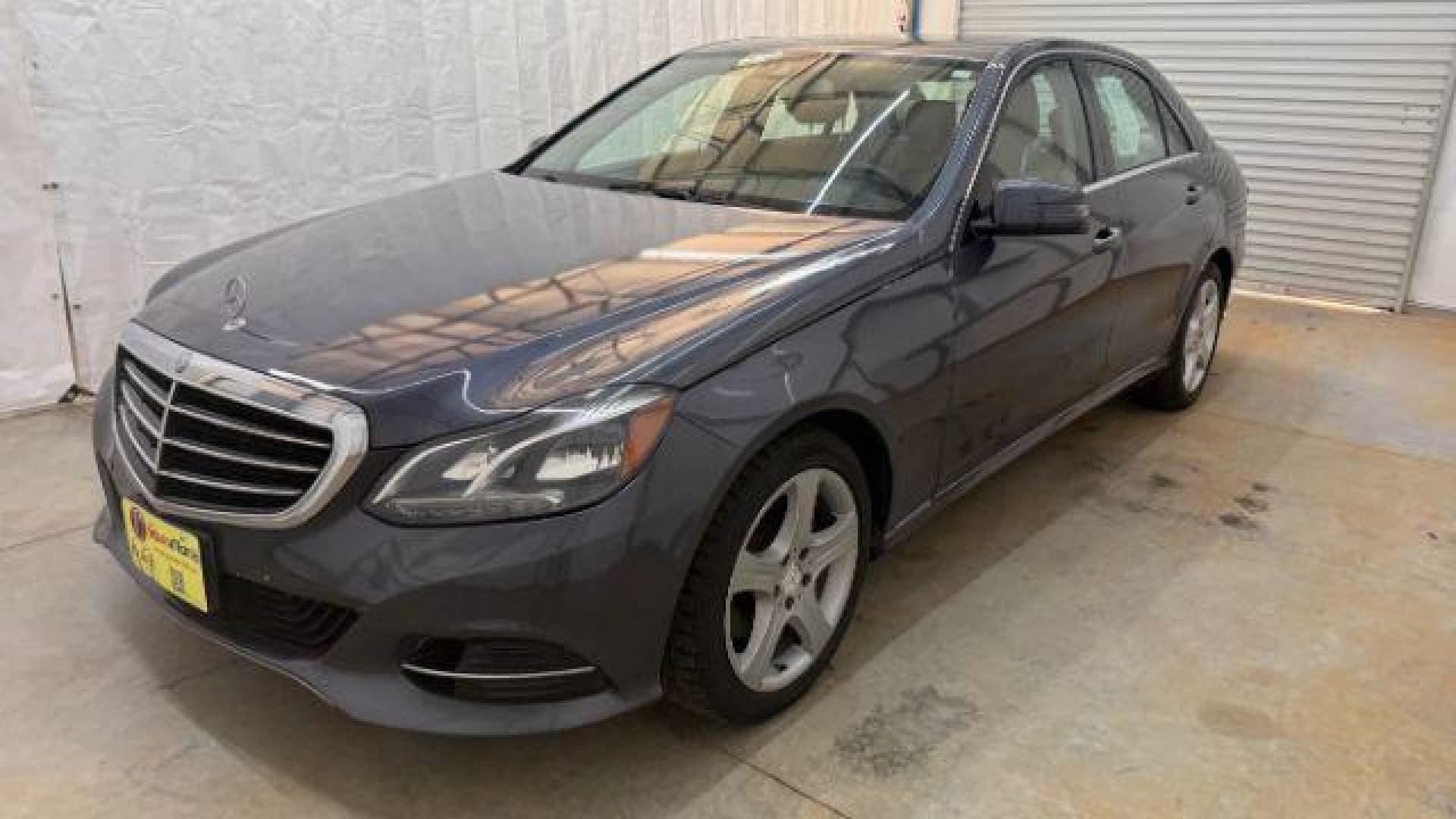 2014 Gray Mercedes-Benz E 350 4MATIC (WDDHF8JB0EA) with an 3.5L V-6 gasoline direct injection engine, located at 1806 Veterans Memorial Hwy SW, Austell, GA, 30168, (770) 944-9558, 33.817959, -84.606987 - Photo#0