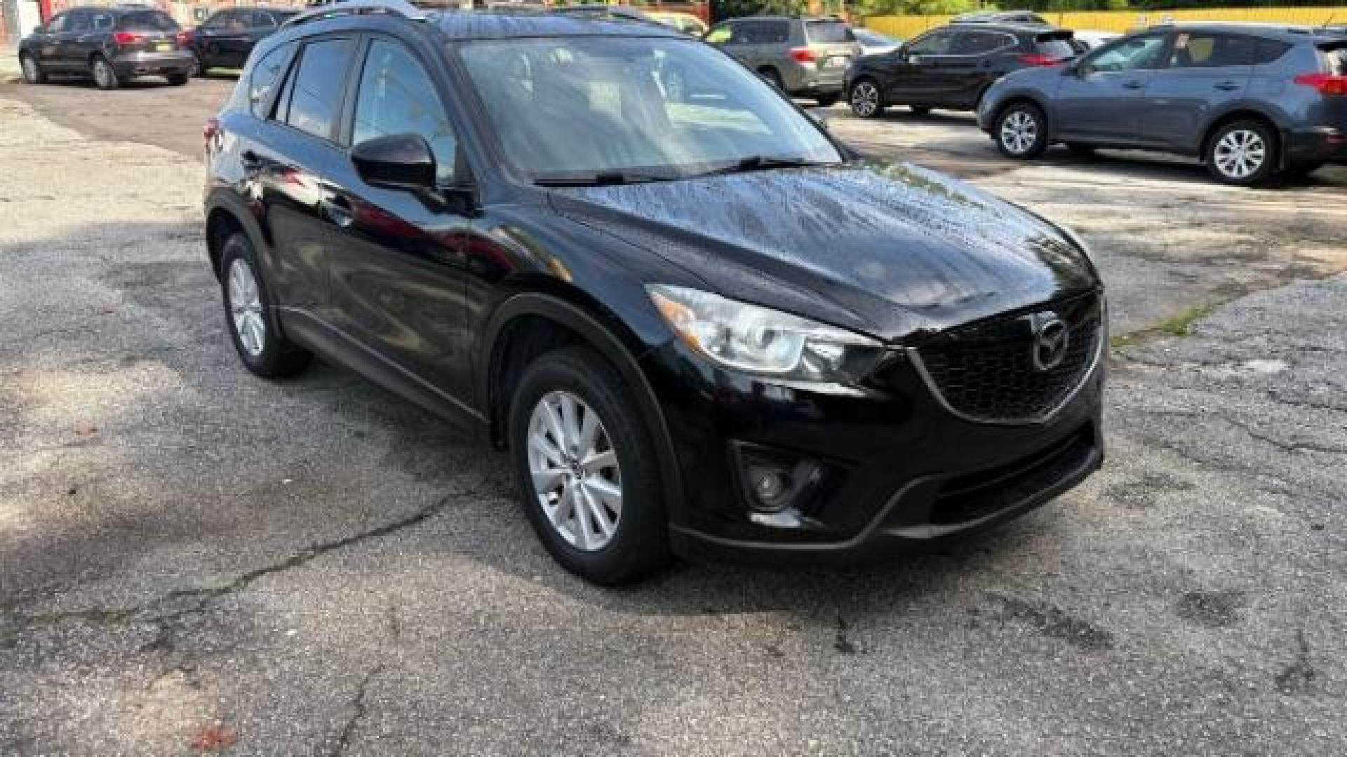 2014 Black Mazda CX-5 Touring (JM3KE2CY7E0) with an SKYACTIV-G 2.5L I-4 gasoline direct injection engine, located at 1806 Veterans Memorial Hwy SW, Austell, GA, 30168, (770) 944-9558, 33.817959, -84.606987 - Photo#2