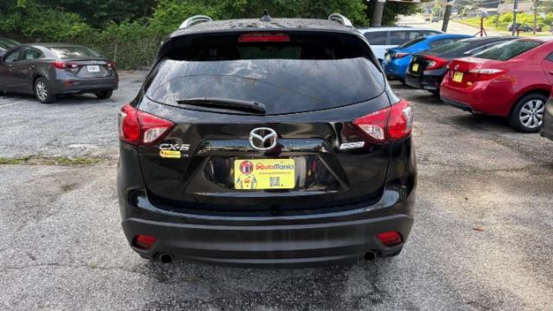 2014 Black Mazda CX-5 Touring (JM3KE2CY7E0) with an SKYACTIV-G 2.5L I-4 gasoline direct injection engine, located at 1806 Veterans Memorial Hwy SW, Austell, GA, 30168, (770) 944-9558, 33.817959, -84.606987 - Photo#4