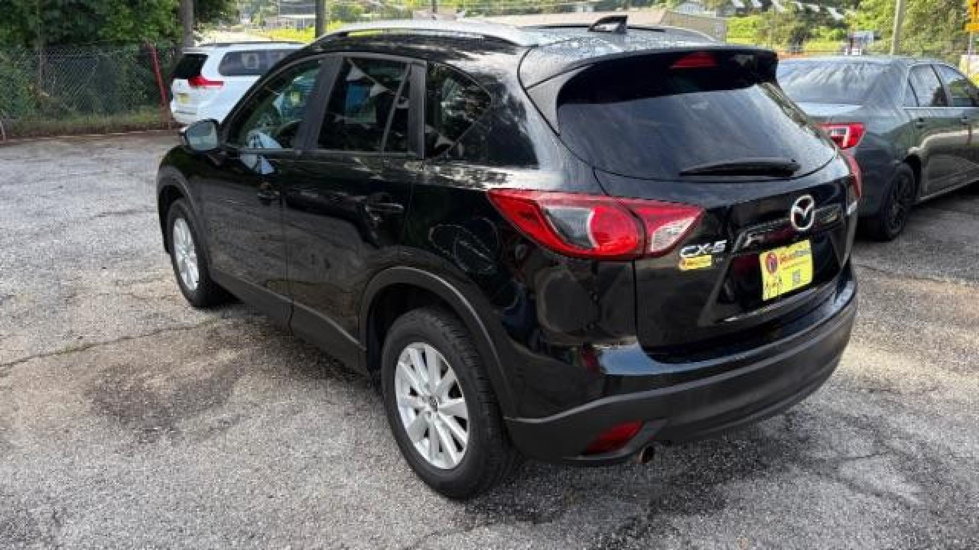 2014 Black Mazda CX-5 Touring (JM3KE2CY7E0) with an SKYACTIV-G 2.5L I-4 gasoline direct injection engine, located at 1806 Veterans Memorial Hwy SW, Austell, GA, 30168, (770) 944-9558, 33.817959, -84.606987 - Photo#5