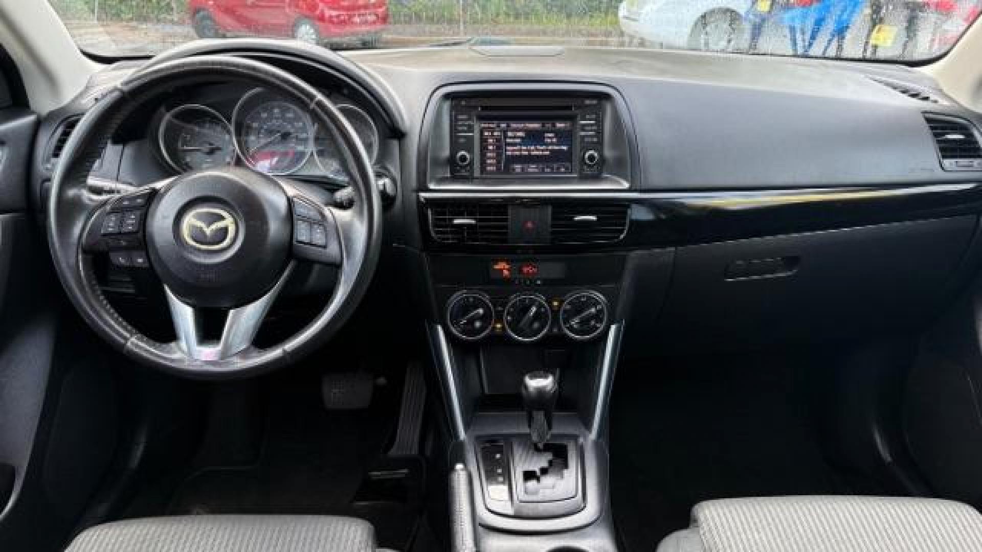2014 Black Mazda CX-5 Touring (JM3KE2CY7E0) with an SKYACTIV-G 2.5L I-4 gasoline direct injection engine, located at 1806 Veterans Memorial Hwy SW, Austell, GA, 30168, (770) 944-9558, 33.817959, -84.606987 - Photo#6