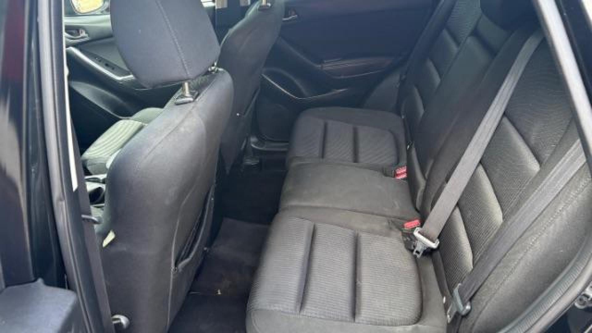 2014 Black Mazda CX-5 Touring (JM3KE2CY7E0) with an SKYACTIV-G 2.5L I-4 gasoline direct injection engine, located at 1806 Veterans Memorial Hwy SW, Austell, GA, 30168, (770) 944-9558, 33.817959, -84.606987 - Photo#11