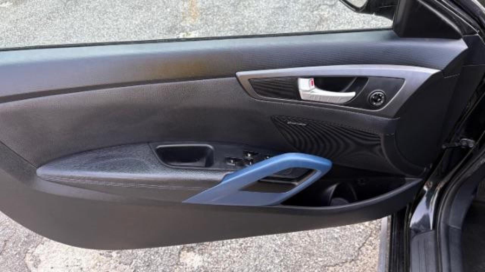 2014 Black Hyundai Veloster Turbo w/Blue (KMHTC6AE7EU) with an 1.6L I-4 gasoline direct injection engine, located at 1806 Veterans Memorial Hwy SW, Austell, GA, 30168, (770) 944-9558, 33.817959, -84.606987 - Photo#9