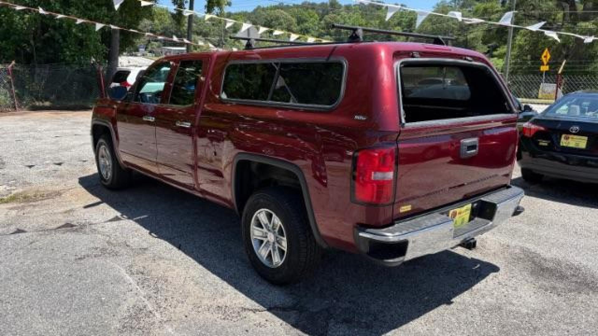 2014 Maroon GMC Sierra 1500 SLE (1GTV2UEC4EZ) with an EcoTec3 5.3L V-8 gasoline direct injection engine, Automatic transmission, located at 1806 Veterans Memorial Hwy SW, Austell, GA, 30168, (770) 944-9558, 33.817959, -84.606987 - Photo#5