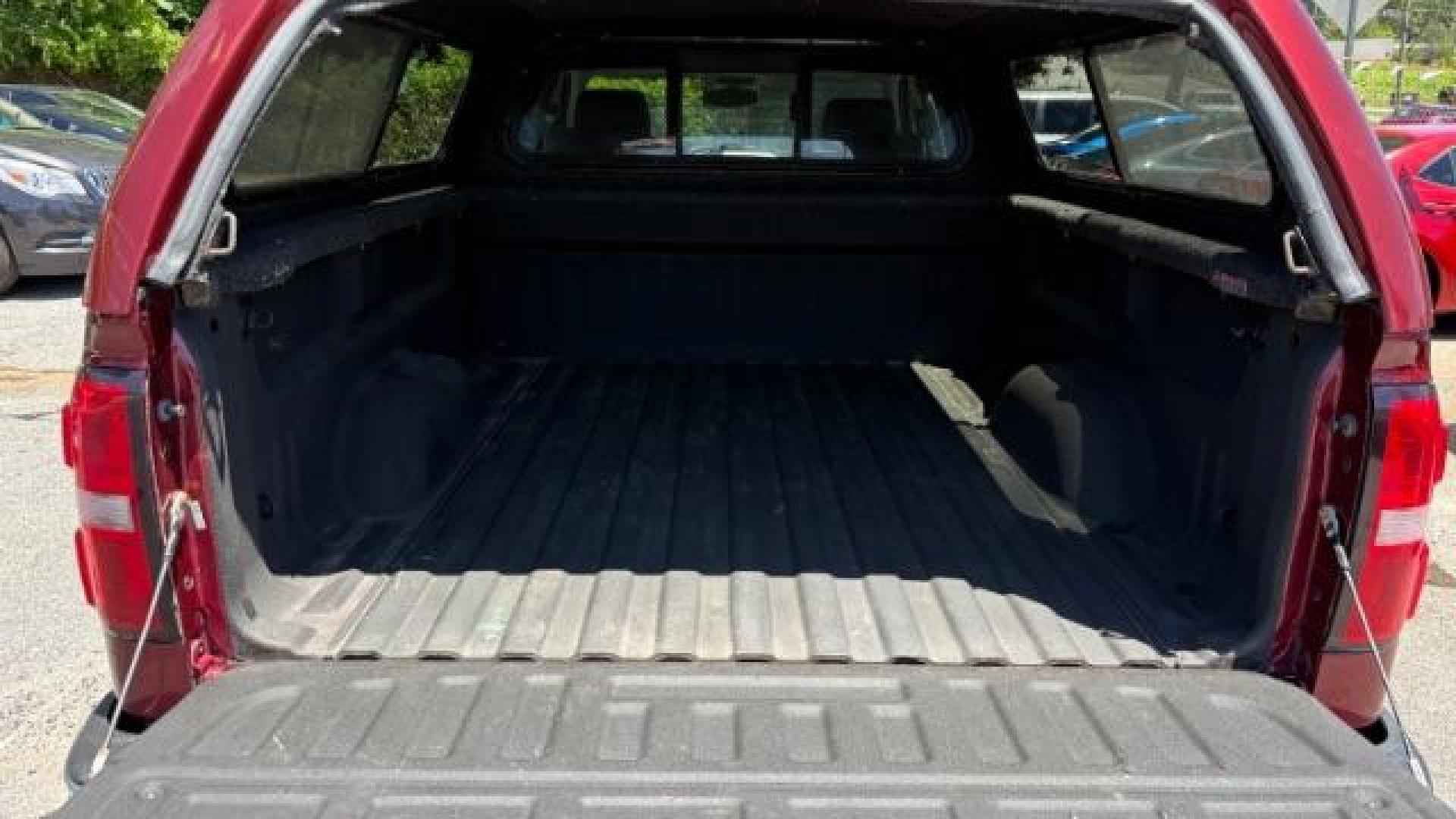 2014 Maroon GMC Sierra 1500 SLE (1GTV2UEC4EZ) with an EcoTec3 5.3L V-8 gasoline direct injection engine, Automatic transmission, located at 1806 Veterans Memorial Hwy SW, Austell, GA, 30168, (770) 944-9558, 33.817959, -84.606987 - Photo#7