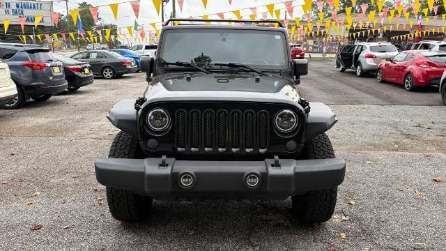 2017 Black Jeep Wrangler Unlimited Sport 4x4 (1C4BJWDG1HL) with an Pentastar 3.6L V-6 DOHC engine, located at 1806 Veterans Memorial Hwy SW, Austell, GA, 30168, (770) 944-9558, 33.817959, -84.606987 - Photo#1