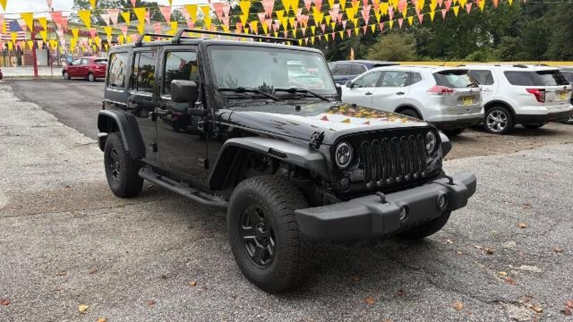 2017 Black Jeep Wrangler Unlimited Sport 4x4 (1C4BJWDG1HL) with an Pentastar 3.6L V-6 DOHC engine, located at 1806 Veterans Memorial Hwy SW, Austell, GA, 30168, (770) 944-9558, 33.817959, -84.606987 - Photo#2