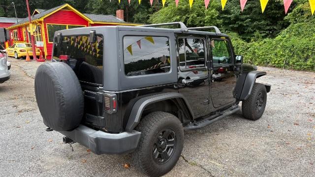 2017 Black Jeep Wrangler Unlimited Sport 4x4 (1C4BJWDG1HL) with an Pentastar 3.6L V-6 DOHC engine, located at 1806 Veterans Memorial Hwy SW, Austell, GA, 30168, (770) 944-9558, 33.817959, -84.606987 - Photo#3