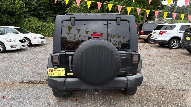 2017 Black Jeep Wrangler Unlimited Sport 4x4 (1C4BJWDG1HL) with an Pentastar 3.6L V-6 DOHC engine, located at 1806 Veterans Memorial Hwy SW, Austell, GA, 30168, (770) 944-9558, 33.817959, -84.606987 - Photo#4