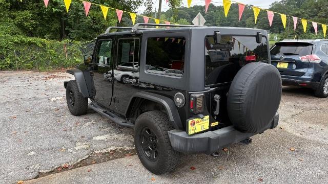 2017 Black Jeep Wrangler Unlimited Sport 4x4 (1C4BJWDG1HL) with an Pentastar 3.6L V-6 DOHC engine, located at 1806 Veterans Memorial Hwy SW, Austell, GA, 30168, (770) 944-9558, 33.817959, -84.606987 - Photo#5