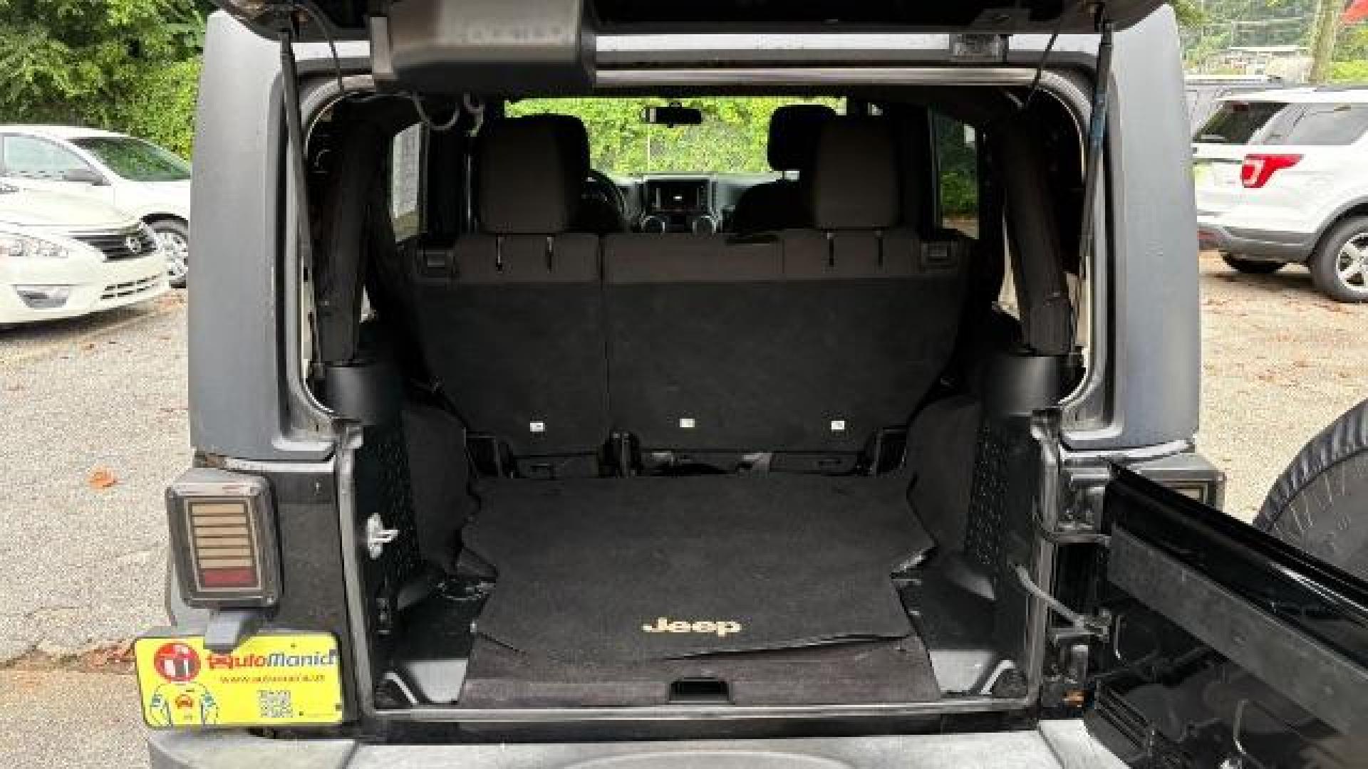 2017 Black Jeep Wrangler Unlimited Sport 4x4 (1C4BJWDG1HL) with an Pentastar 3.6L V-6 DOHC engine, located at 1806 Veterans Memorial Hwy SW, Austell, GA, 30168, (770) 944-9558, 33.817959, -84.606987 - Photo#6