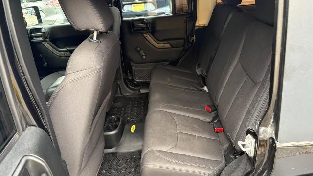 2017 Black Jeep Wrangler Unlimited Sport 4x4 (1C4BJWDG1HL) with an Pentastar 3.6L V-6 DOHC engine, located at 1806 Veterans Memorial Hwy SW, Austell, GA, 30168, (770) 944-9558, 33.817959, -84.606987 - Photo#7