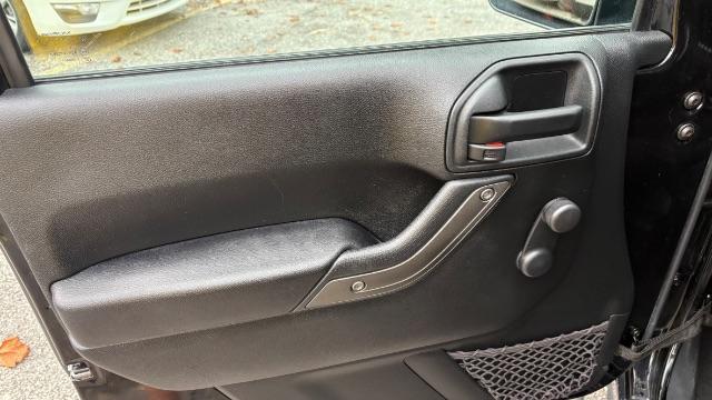 2017 Black Jeep Wrangler Unlimited Sport 4x4 (1C4BJWDG1HL) with an Pentastar 3.6L V-6 DOHC engine, located at 1806 Veterans Memorial Hwy SW, Austell, GA, 30168, (770) 944-9558, 33.817959, -84.606987 - Photo#9