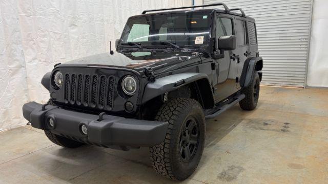 2017 Black Jeep Wrangler Unlimited Sport 4x4 (1C4BJWDG1HL) with an Pentastar 3.6L V-6 DOHC engine, located at 1806 Veterans Memorial Hwy SW, Austell, GA, 30168, (770) 944-9558, 33.817959, -84.606987 - Photo#0