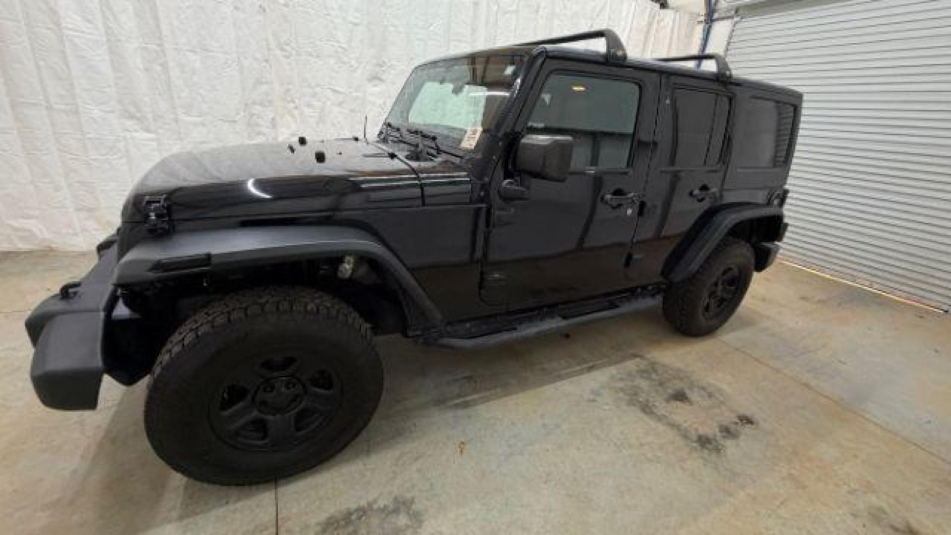 2017 Black Jeep Wrangler Unlimited Sport 4x4 (1C4BJWDG1HL) with an Pentastar 3.6L V-6 DOHC engine, located at 1806 Veterans Memorial Hwy SW, Austell, GA, 30168, (770) 944-9558, 33.817959, -84.606987 - Photo#1