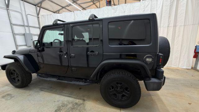 2017 Black Jeep Wrangler Unlimited Sport 4x4 (1C4BJWDG1HL) with an Pentastar 3.6L V-6 DOHC engine, located at 1806 Veterans Memorial Hwy SW, Austell, GA, 30168, (770) 944-9558, 33.817959, -84.606987 - Photo#2
