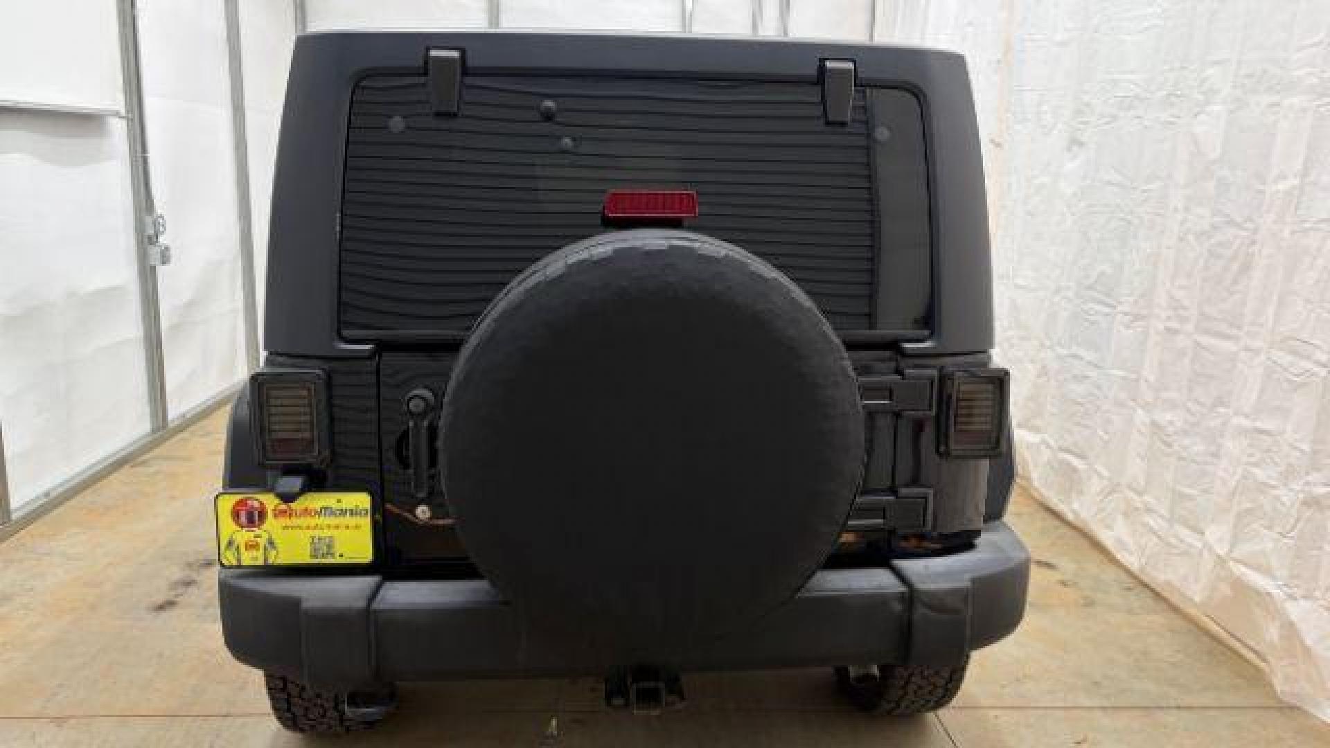 2017 Black Jeep Wrangler Unlimited Sport 4x4 (1C4BJWDG1HL) with an Pentastar 3.6L V-6 DOHC engine, located at 1806 Veterans Memorial Hwy SW, Austell, GA, 30168, (770) 944-9558, 33.817959, -84.606987 - Photo#4