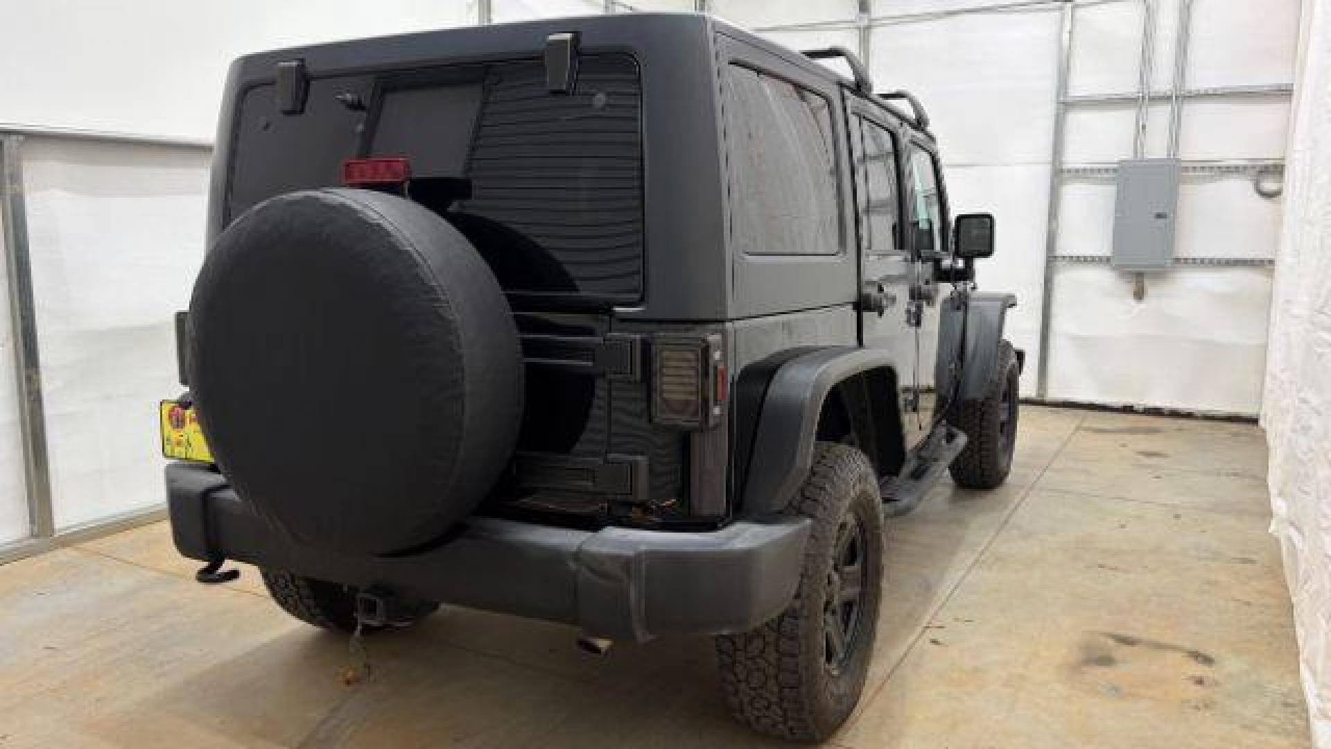 2017 Black Jeep Wrangler Unlimited Sport 4x4 (1C4BJWDG1HL) with an Pentastar 3.6L V-6 DOHC engine, located at 1806 Veterans Memorial Hwy SW, Austell, GA, 30168, (770) 944-9558, 33.817959, -84.606987 - Photo#5