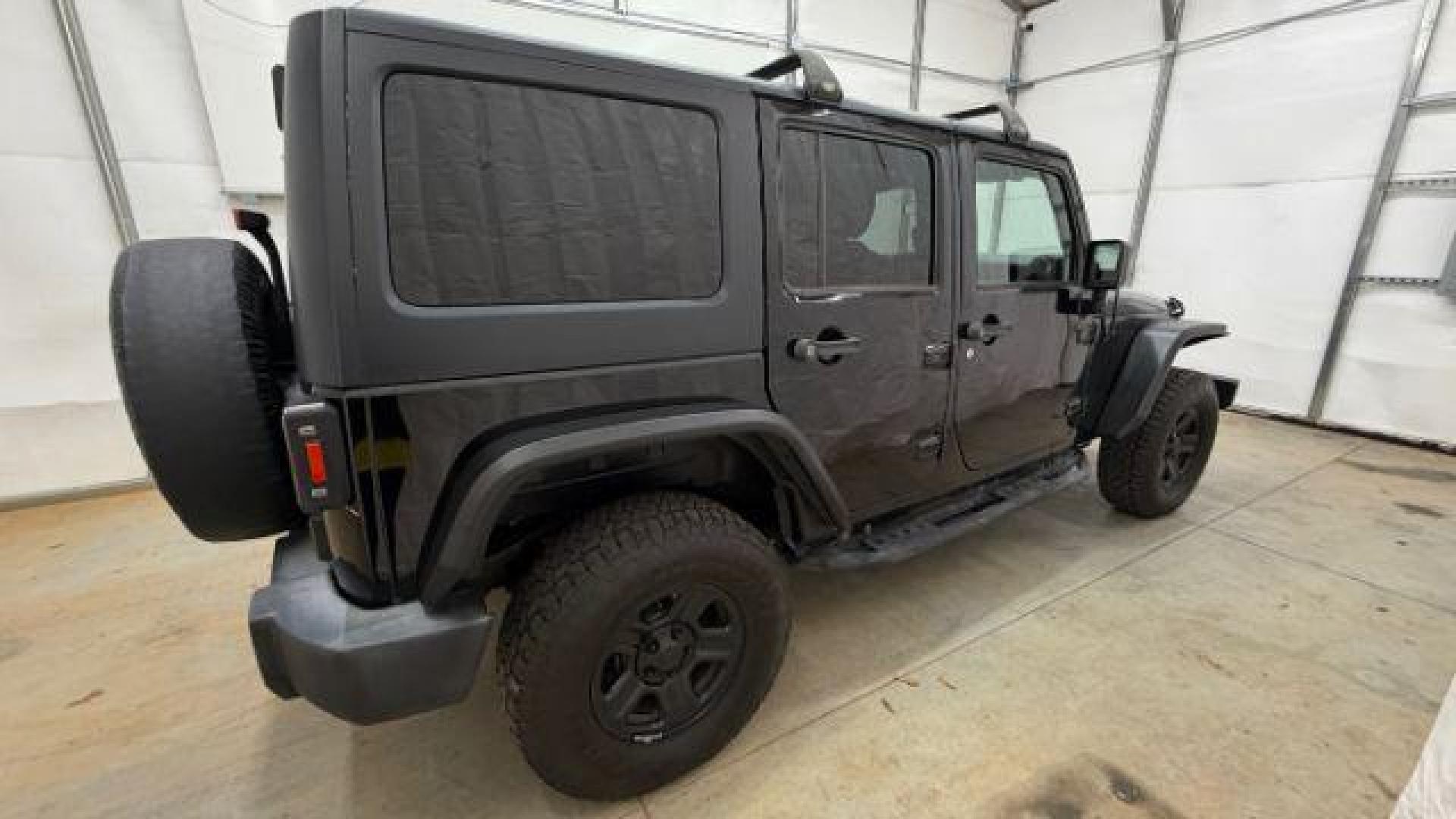 2017 Black Jeep Wrangler Unlimited Sport 4x4 (1C4BJWDG1HL) with an Pentastar 3.6L V-6 DOHC engine, located at 1806 Veterans Memorial Hwy SW, Austell, GA, 30168, (770) 944-9558, 33.817959, -84.606987 - Photo#6