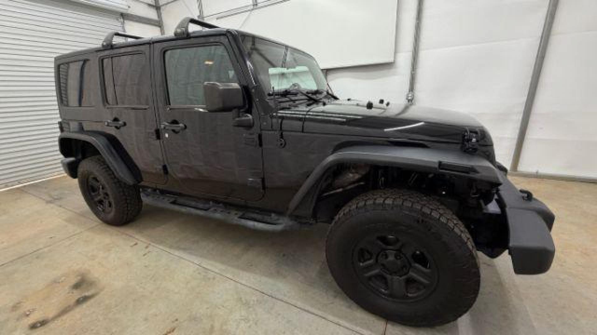 2017 Black Jeep Wrangler Unlimited Sport 4x4 (1C4BJWDG1HL) with an Pentastar 3.6L V-6 DOHC engine, located at 1806 Veterans Memorial Hwy SW, Austell, GA, 30168, (770) 944-9558, 33.817959, -84.606987 - Photo#7