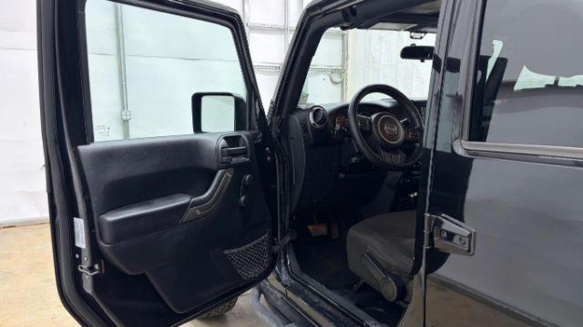 2017 Black Jeep Wrangler Unlimited Sport 4x4 (1C4BJWDG1HL) with an Pentastar 3.6L V-6 DOHC engine, located at 1806 Veterans Memorial Hwy SW, Austell, GA, 30168, (770) 944-9558, 33.817959, -84.606987 - Photo#10