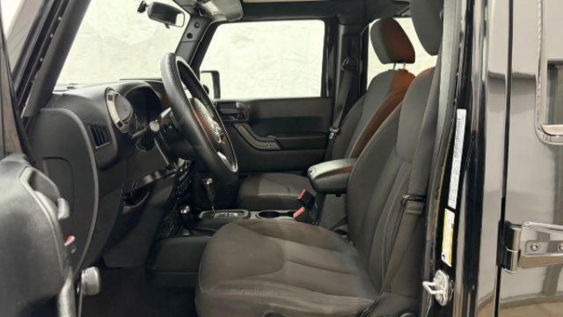 2017 Black Jeep Wrangler Unlimited Sport 4x4 (1C4BJWDG1HL) with an Pentastar 3.6L V-6 DOHC engine, located at 1806 Veterans Memorial Hwy SW, Austell, GA, 30168, (770) 944-9558, 33.817959, -84.606987 - Photo#11