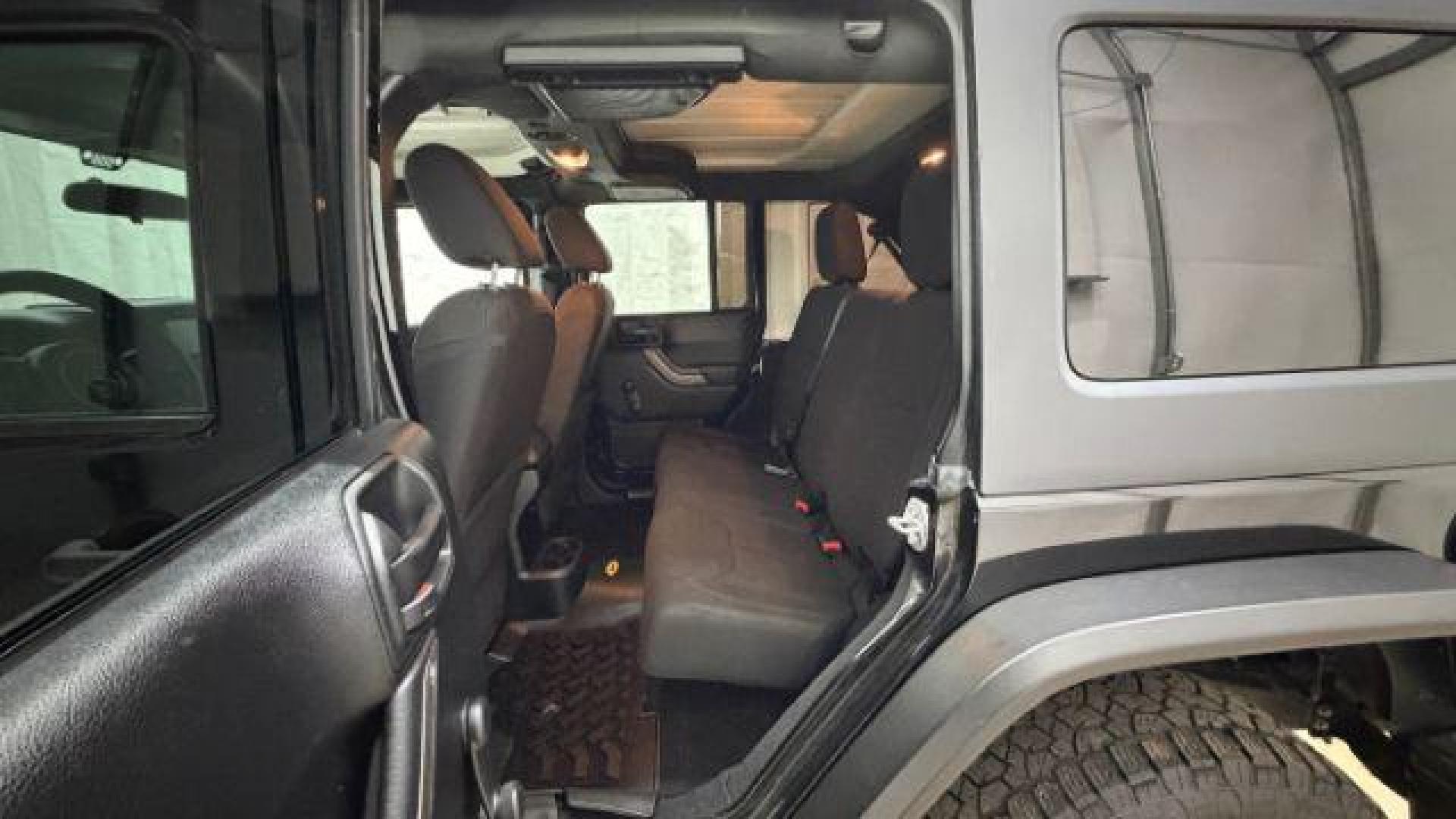 2017 Black Jeep Wrangler Unlimited Sport 4x4 (1C4BJWDG1HL) with an Pentastar 3.6L V-6 DOHC engine, located at 1806 Veterans Memorial Hwy SW, Austell, GA, 30168, (770) 944-9558, 33.817959, -84.606987 - Photo#14