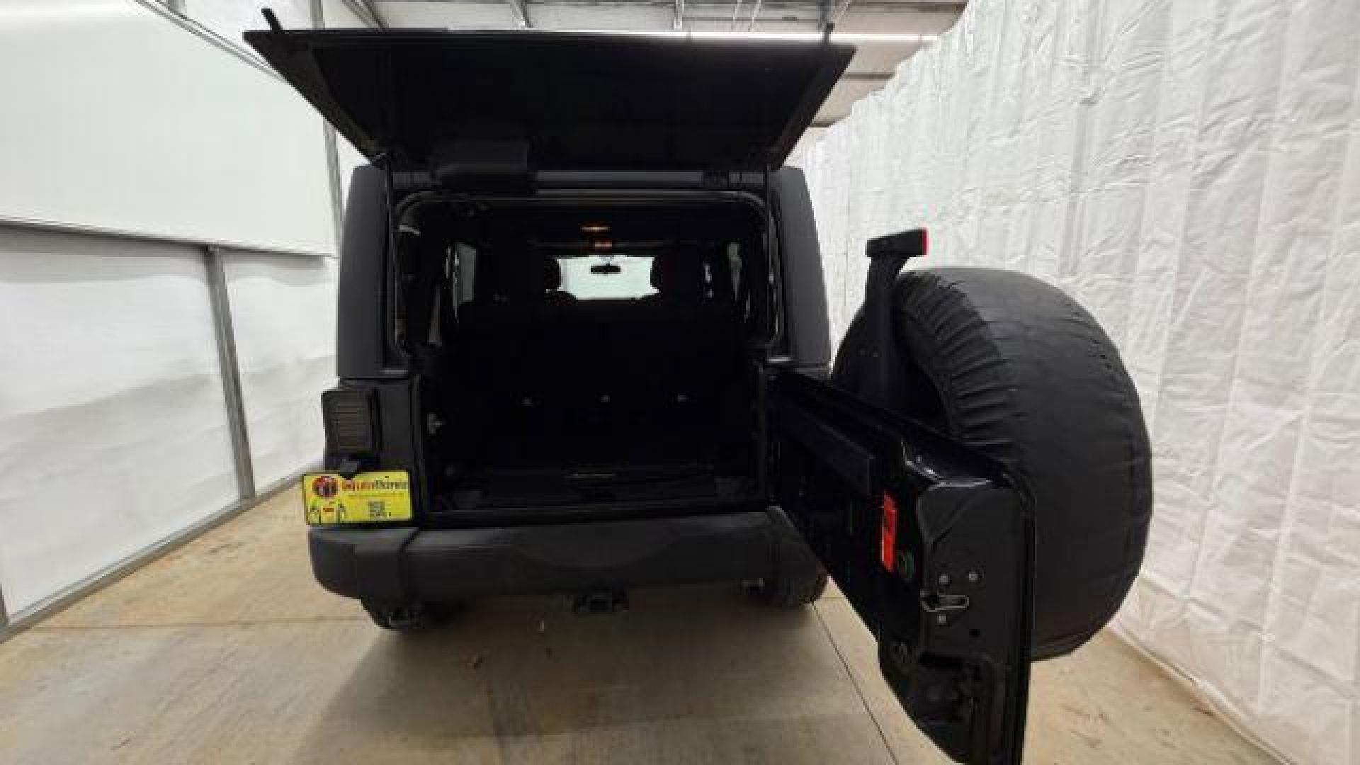 2017 Black Jeep Wrangler Unlimited Sport 4x4 (1C4BJWDG1HL) with an Pentastar 3.6L V-6 DOHC engine, located at 1806 Veterans Memorial Hwy SW, Austell, GA, 30168, (770) 944-9558, 33.817959, -84.606987 - Photo#16