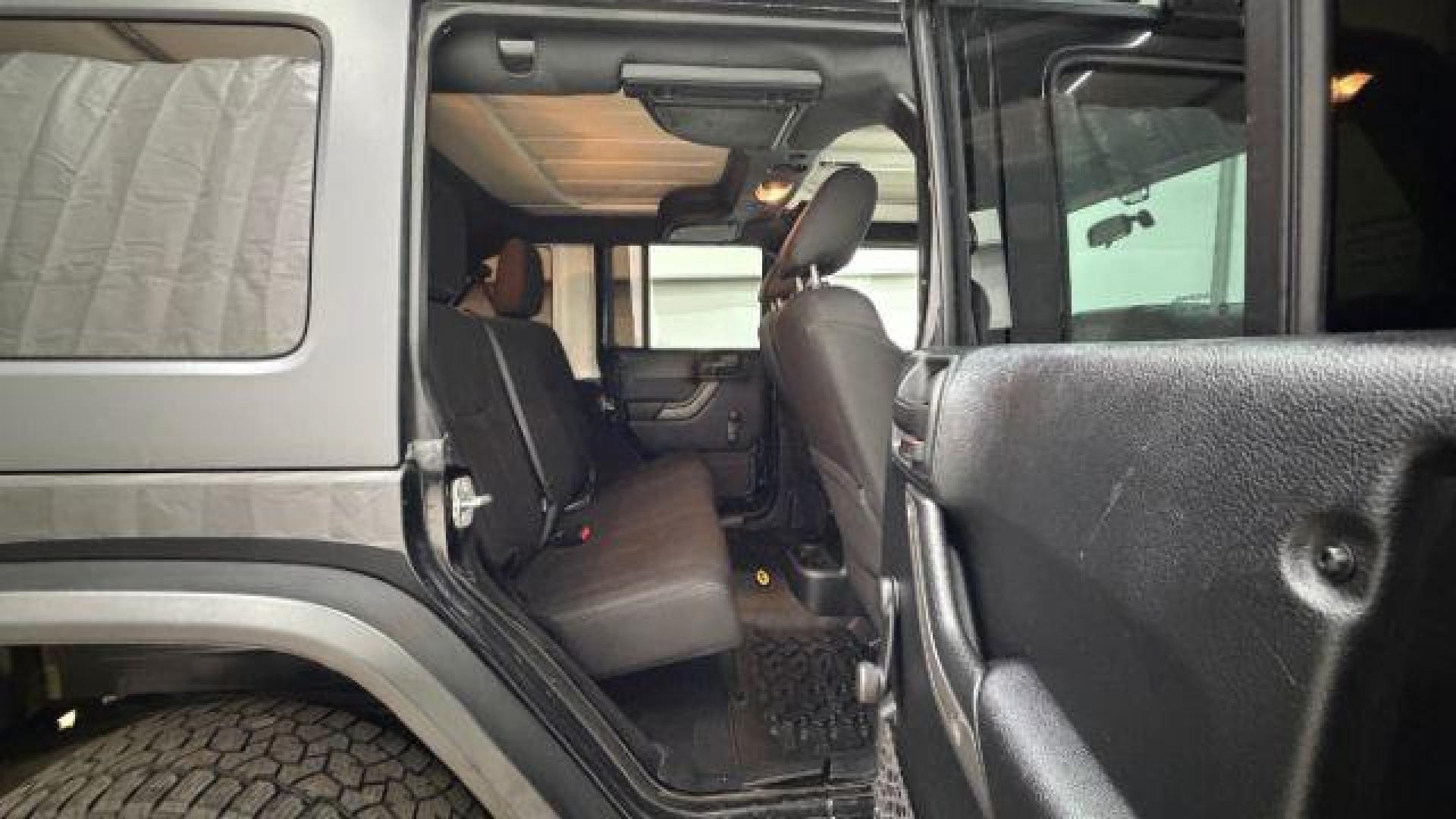 2017 Black Jeep Wrangler Unlimited Sport 4x4 (1C4BJWDG1HL) with an Pentastar 3.6L V-6 DOHC engine, located at 1806 Veterans Memorial Hwy SW, Austell, GA, 30168, (770) 944-9558, 33.817959, -84.606987 - Photo#17