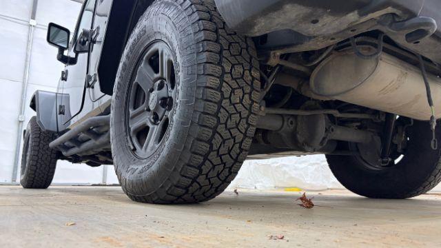 2017 Black Jeep Wrangler Unlimited Sport 4x4 (1C4BJWDG1HL) with an Pentastar 3.6L V-6 DOHC engine, located at 1806 Veterans Memorial Hwy SW, Austell, GA, 30168, (770) 944-9558, 33.817959, -84.606987 - Photo#22