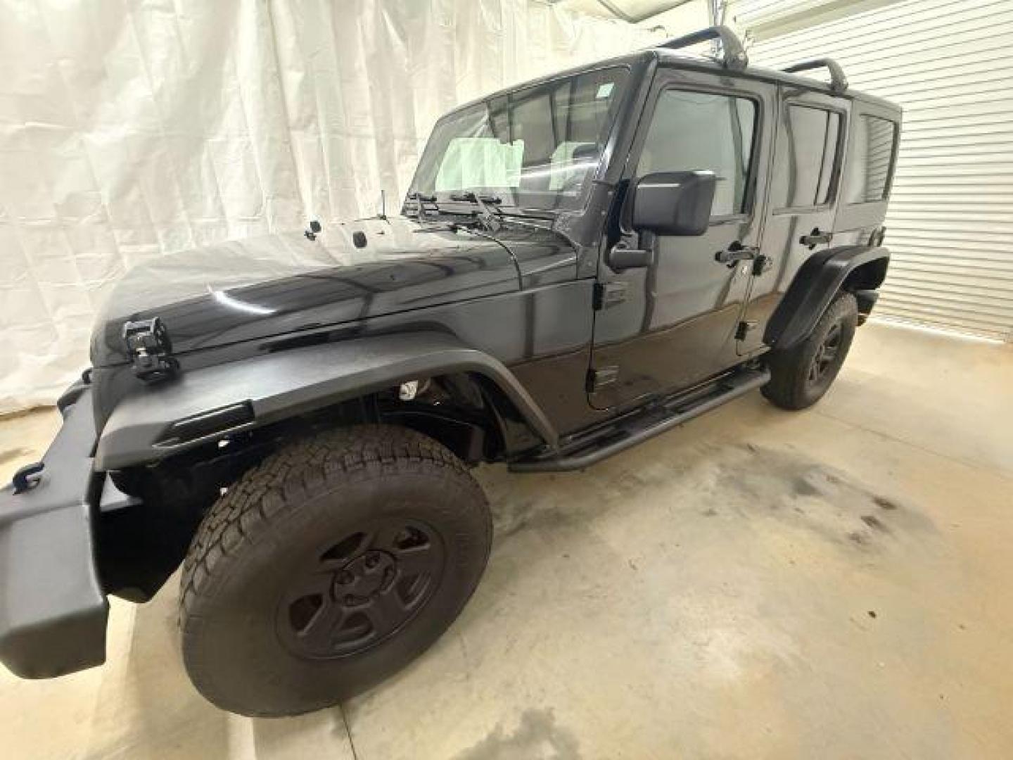 2017 Black /Black Jeep Wrangler Unlimited Sport 4x4 (1C4BJWDG1HL) with an Pentastar 3.6L V-6 DOHC engine, located at 1806 Veterans Memorial Hwy SW, Austell, GA, 30168, (770) 944-9558, 33.817959, -84.606987 - Photo#1