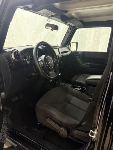 2017 Black /Black Jeep Wrangler Unlimited Sport 4x4 (1C4BJWDG1HL) with an Pentastar 3.6L V-6 DOHC engine, located at 1806 Veterans Memorial Hwy SW, Austell, GA, 30168, (770) 944-9558, 33.817959, -84.606987 - Photo#10