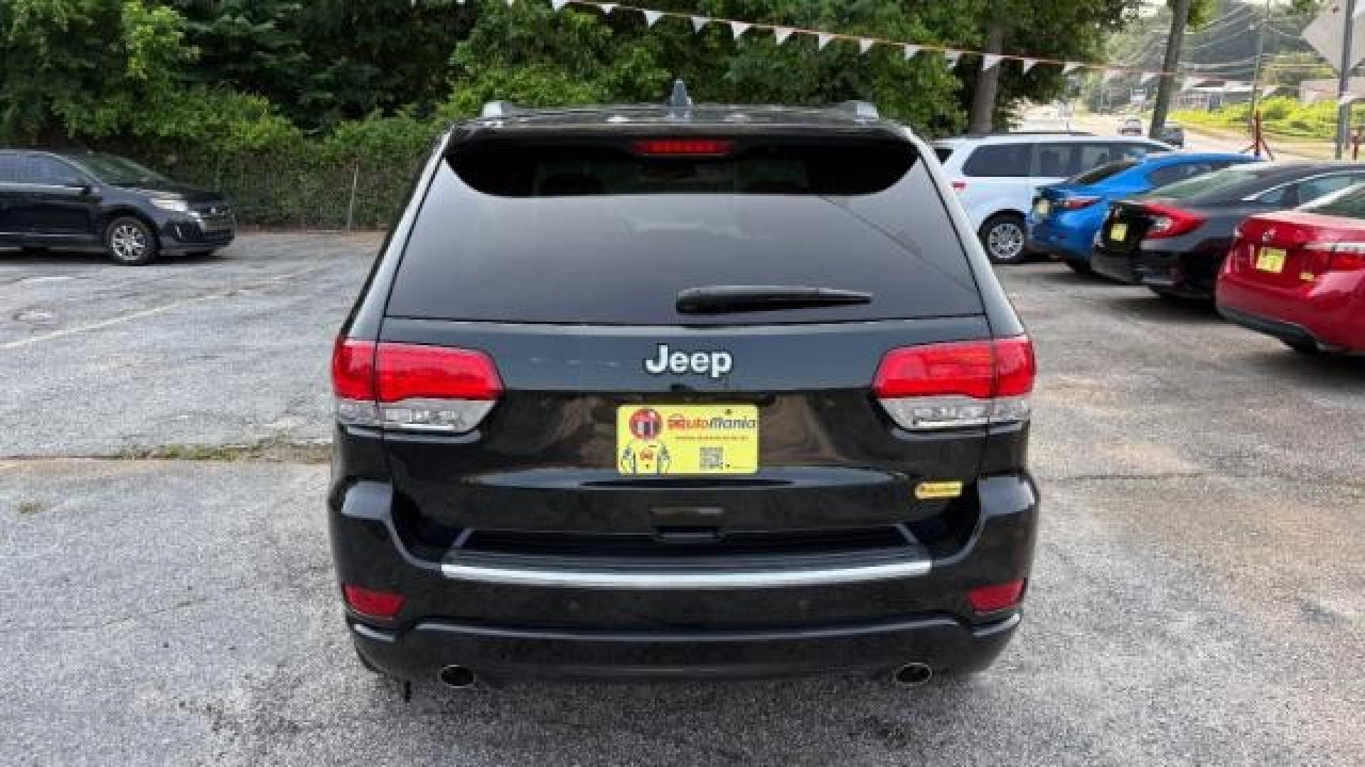 2014 Green Jeep Grand Cherokee Overland (1C4RJECG5EC) with an 3.6L V-6 DOHC engine, located at 1806 Veterans Memorial Hwy SW, Austell, GA, 30168, (770) 944-9558, 33.817959, -84.606987 - Photo#4