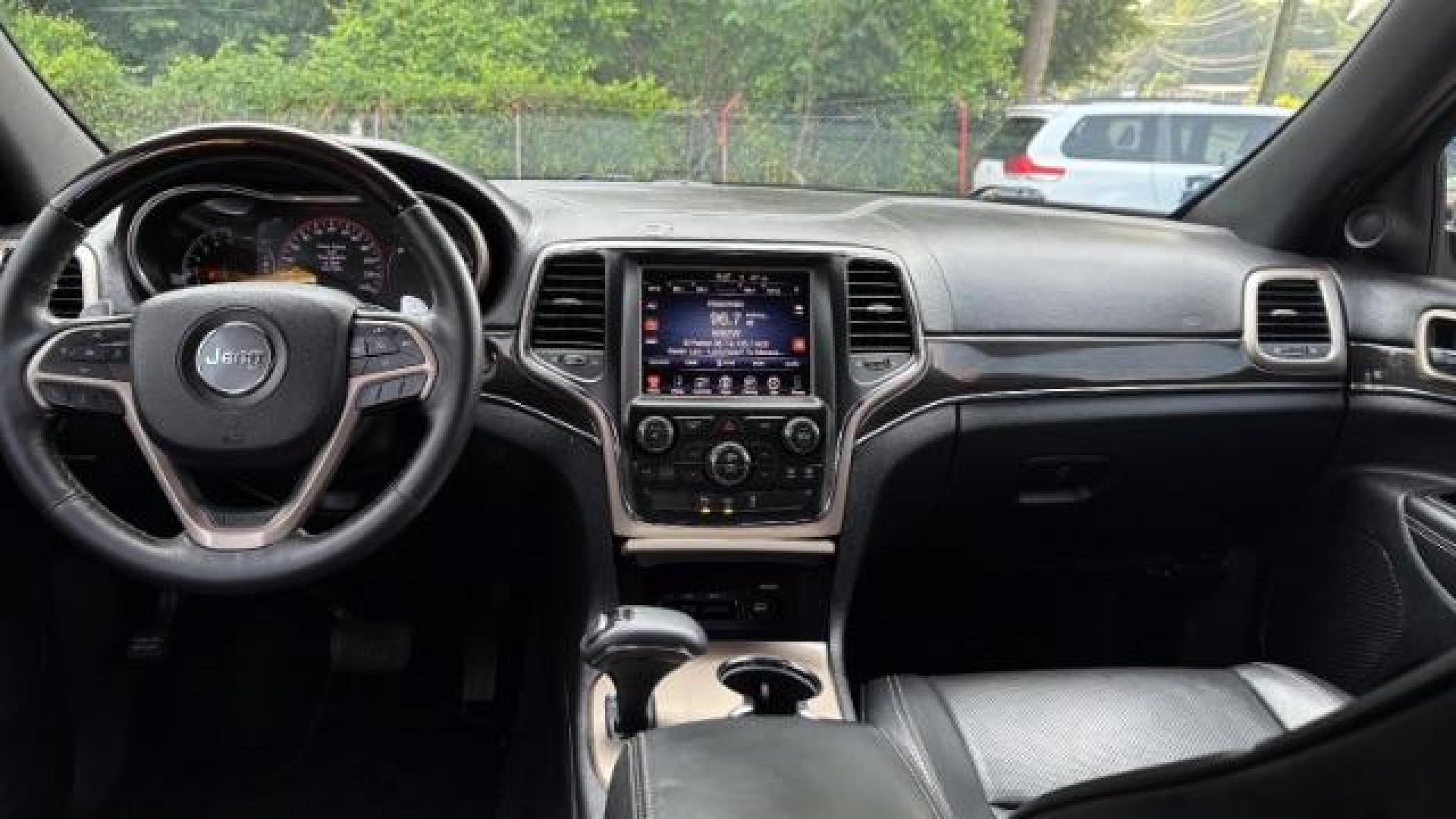 2014 Green Jeep Grand Cherokee Overland (1C4RJECG5EC) with an 3.6L V-6 DOHC engine, located at 1806 Veterans Memorial Hwy SW, Austell, GA, 30168, (770) 944-9558, 33.817959, -84.606987 - Photo#9