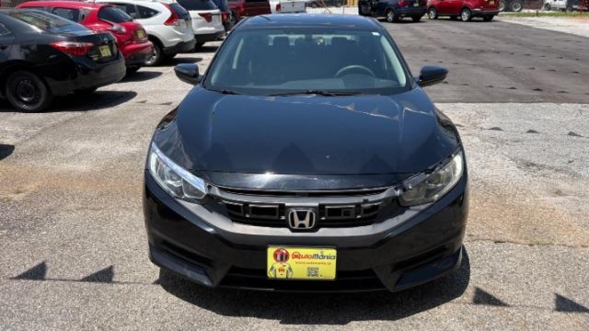 2017 Black Honda Civic LX (19XFC2F56HE) with an 2L I-4 DOHC engine, located at 1806 Veterans Memorial Hwy SW, Austell, GA, 30168, (770) 944-9558, 33.817959, -84.606987 - Photo#1