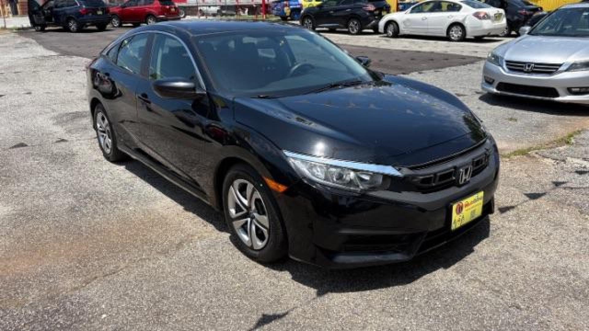 2017 Black Honda Civic LX (19XFC2F56HE) with an 2L I-4 DOHC engine, located at 1806 Veterans Memorial Hwy SW, Austell, GA, 30168, (770) 944-9558, 33.817959, -84.606987 - Photo#2