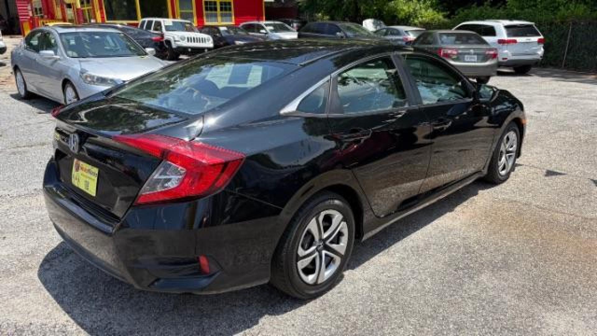 2017 Black Honda Civic LX (19XFC2F56HE) with an 2L I-4 DOHC engine, located at 1806 Veterans Memorial Hwy SW, Austell, GA, 30168, (770) 944-9558, 33.817959, -84.606987 - Photo#3