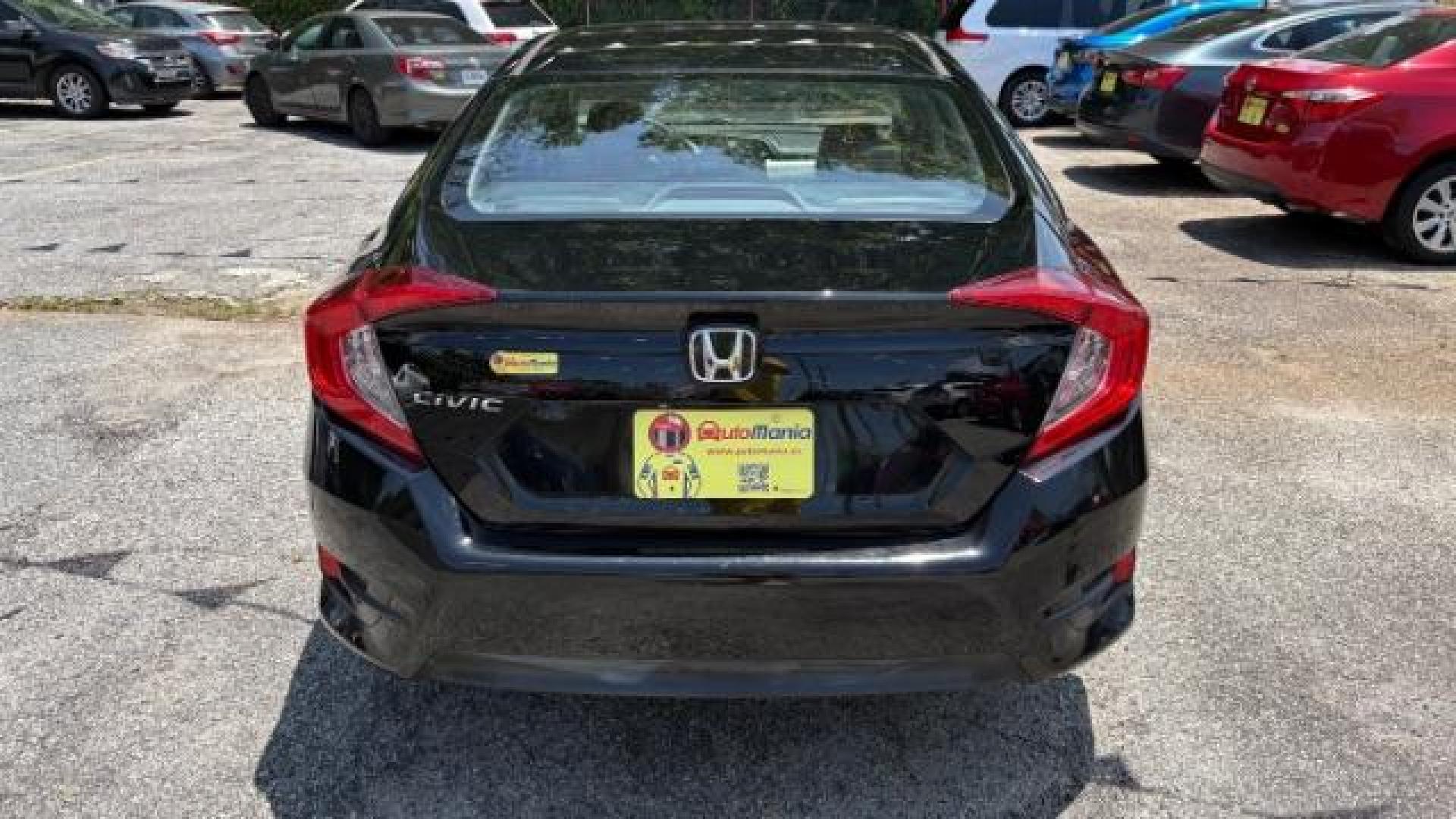 2017 Black Honda Civic LX (19XFC2F56HE) with an 2L I-4 DOHC engine, located at 1806 Veterans Memorial Hwy SW, Austell, GA, 30168, (770) 944-9558, 33.817959, -84.606987 - Photo#4