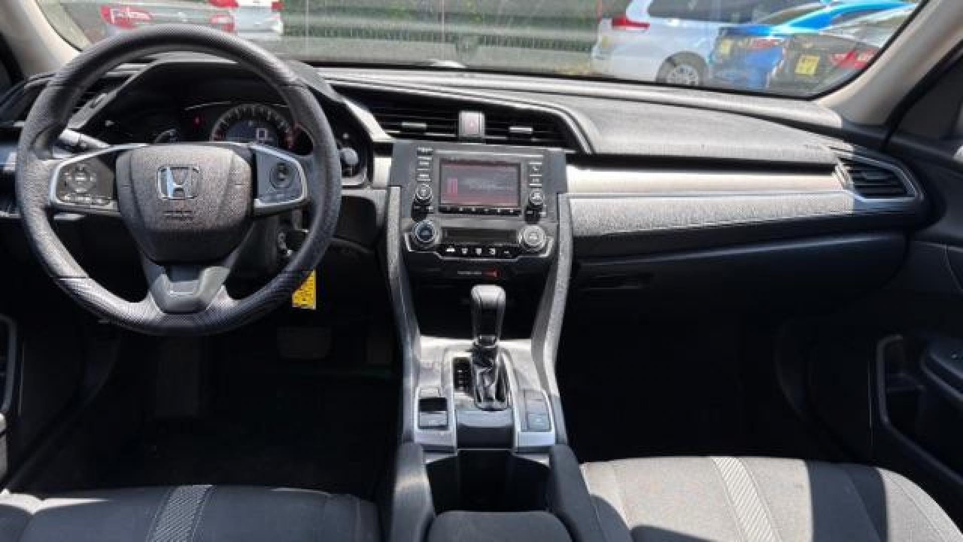 2017 Black Honda Civic LX (19XFC2F56HE) with an 2L I-4 DOHC engine, located at 1806 Veterans Memorial Hwy SW, Austell, GA, 30168, (770) 944-9558, 33.817959, -84.606987 - Photo#9