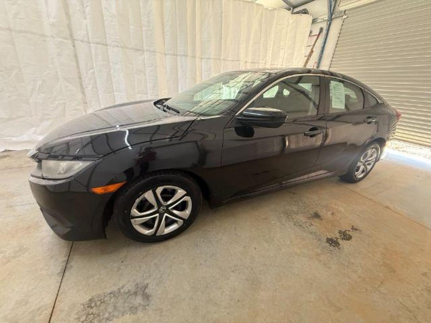 2017 Black Honda Civic LX (19XFC2F56HE) with an 2L I-4 DOHC engine, located at 1806 Veterans Memorial Hwy SW, Austell, GA, 30168, (770) 944-9558, 33.817959, -84.606987 - Photo#1
