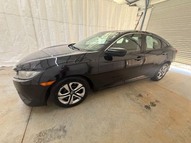 2017 Black Honda Civic LX (19XFC2F56HE) with an 2L I-4 DOHC engine, located at 1806 Veterans Memorial Hwy SW, Austell, GA, 30168, (770) 944-9558, 33.817959, -84.606987 - Photo#1