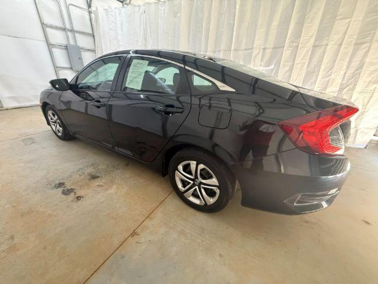 2017 Black Honda Civic LX (19XFC2F56HE) with an 2L I-4 DOHC engine, located at 1806 Veterans Memorial Hwy SW, Austell, GA, 30168, (770) 944-9558, 33.817959, -84.606987 - Photo#2