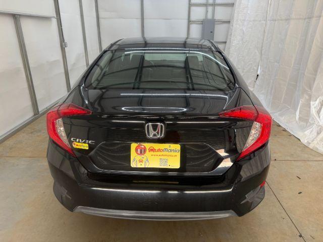 2017 Black Honda Civic LX (19XFC2F56HE) with an 2L I-4 DOHC engine, located at 1806 Veterans Memorial Hwy SW, Austell, GA, 30168, (770) 944-9558, 33.817959, -84.606987 - Photo#4