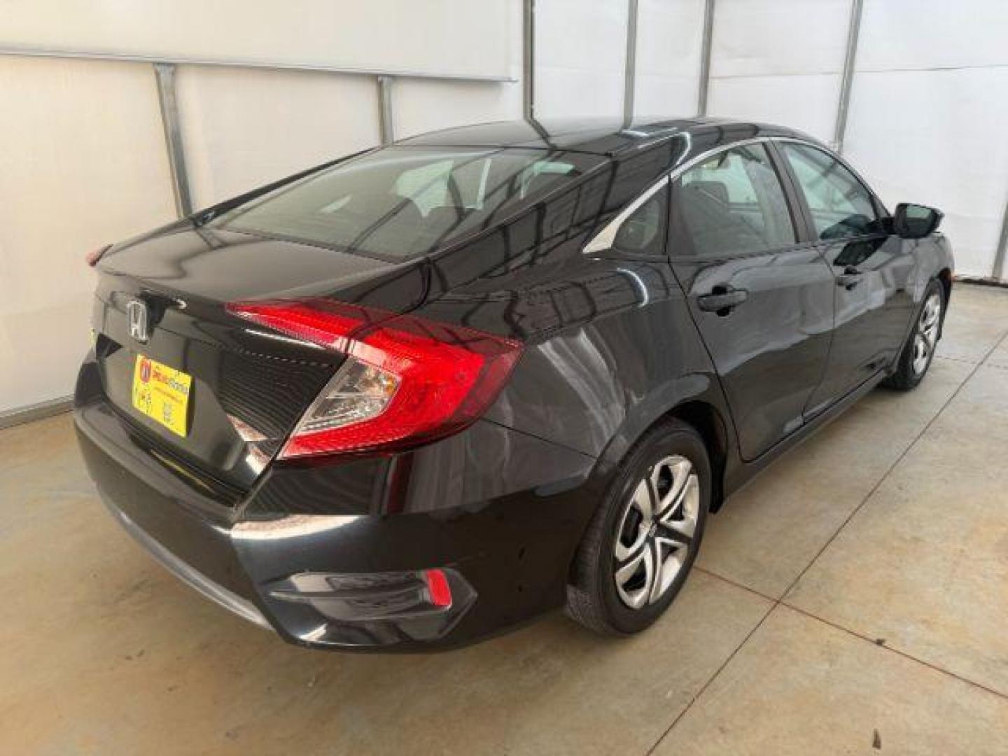2017 Black Honda Civic LX (19XFC2F56HE) with an 2L I-4 DOHC engine, located at 1806 Veterans Memorial Hwy SW, Austell, GA, 30168, (770) 944-9558, 33.817959, -84.606987 - Photo#5